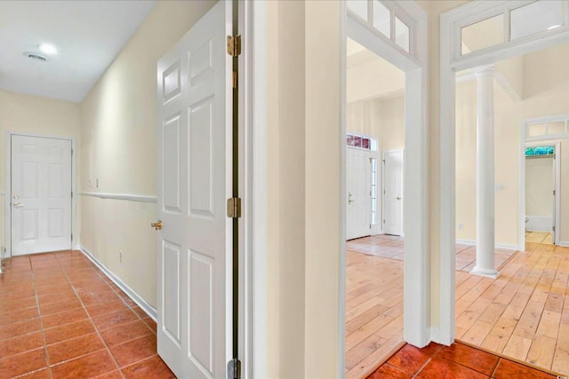 154 Windsor Cir SW, Ocean Isle Beach, NC 28469 - hall with tile patterned flooring, ornate columns, and baseboards