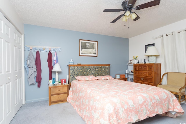 510 Fairwood Lakes Dr Unit 17-P, Myrtle Beach, SC 29588 - bedroom with carpet, a closet, a textured ceiling, ceiling fan, and baseboards