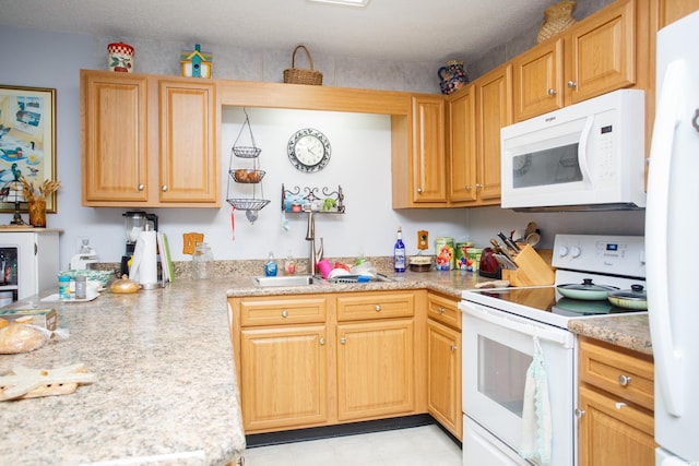510 Fairwood Lakes Dr Unit 17-P, Myrtle Beach, SC 29588 - kitchen with white appliances, light countertops, a sink, and light tile patterned floors