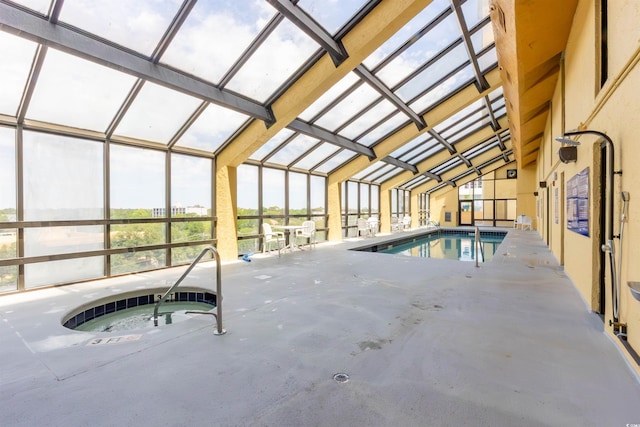 view of swimming pool featuring an in-ground hot tub