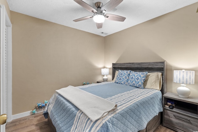 625 N Waccamaw Dr Unit 107, Murrells Inlet, SC 29576 - bedroom featuring wood finished floors, baseboards, and a ceiling fan