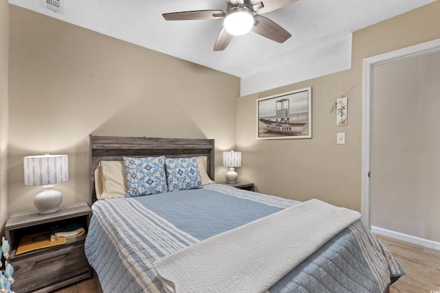 625 N Waccamaw Dr Unit 107, Murrells Inlet, SC 29576 - bedroom featuring wood finished floors, baseboards, and a ceiling fan