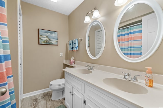 625 N Waccamaw Dr Unit 107, Murrells Inlet, SC 29576 - bathroom featuring toilet, double vanity, marble look tiles, baseboards, and a shower with curtain