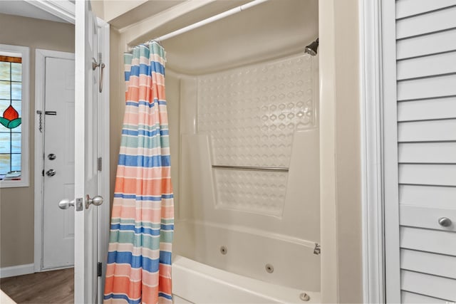 625 N Waccamaw Dr Unit 107, Murrells Inlet, SC 29576 - full bathroom with a combined bath / shower with jetted tub, baseboards, and wood finished floors