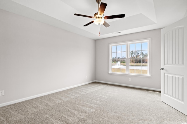 154 Six Mile Creek Dr, Georgetown, SC 29440 - carpeted empty room with a tray ceiling, ceiling fan, and baseboards