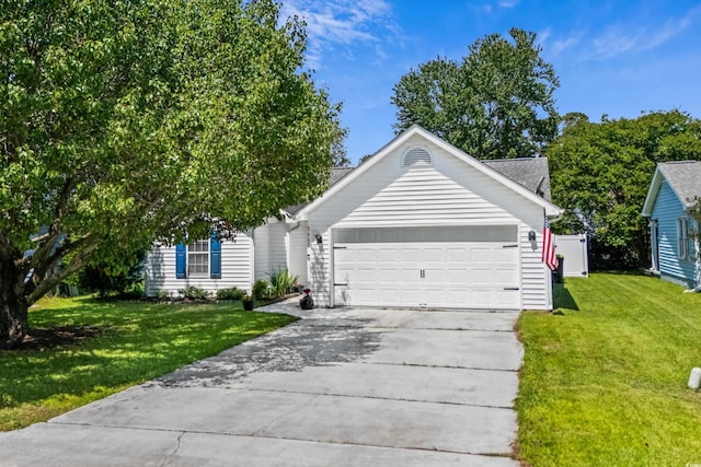 view of front of house featuring driveway, a front yard, and a garage