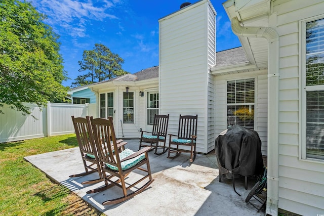 view of patio with fence and grilling area