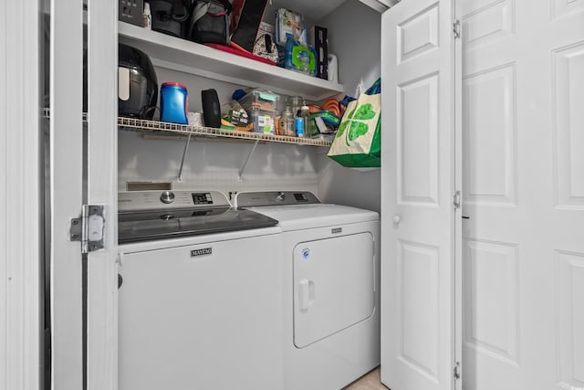 washroom featuring washing machine and dryer