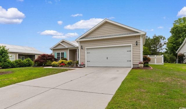 ranch-style house featuring a garage and concrete driveway