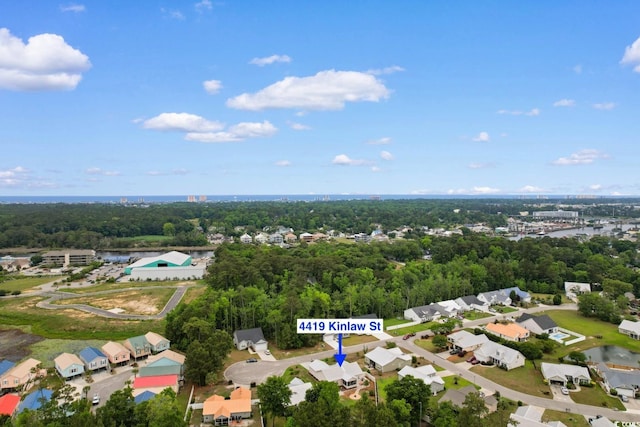 aerial perspective of suburban area featuring a large body of water