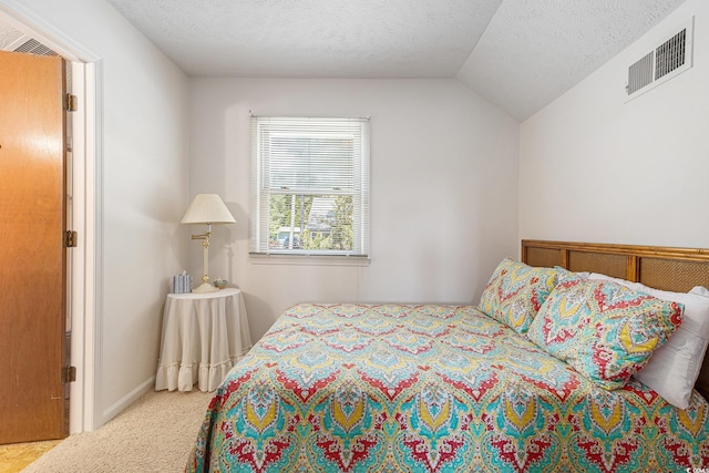 2191 Liberty Cir, Little River, SC 29566 - carpeted bedroom with vaulted ceiling and a textured ceiling