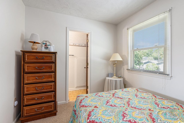 2191 Liberty Cir, Little River, SC 29566 - bedroom featuring carpet floors, a textured ceiling, and baseboards