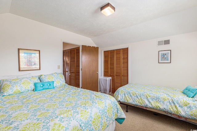 2191 Liberty Cir, Little River, SC 29566 - carpeted bedroom with vaulted ceiling and multiple closets