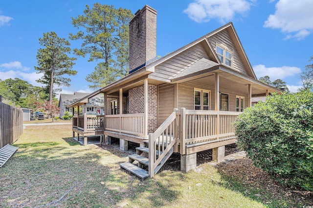 2191 Liberty Cir, Little River, SC 29566 - view of side of home with a chimney and a deck