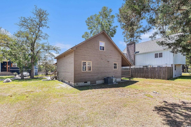 2191 Liberty Cir, Little River, SC 29566 - back of property featuring crawl space, a chimney, and cooling unit