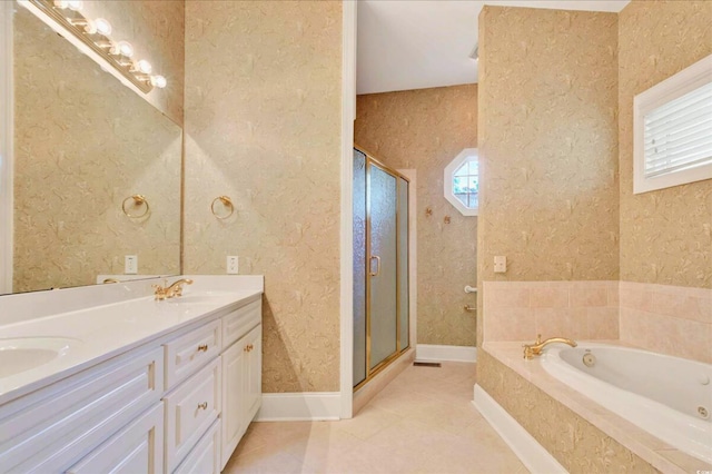 79 Windsor Cir SW, Ocean Isle Beach, NC 28469 - bathroom featuring a shower stall, a garden tub, double vanity, tile patterned floors, and baseboards