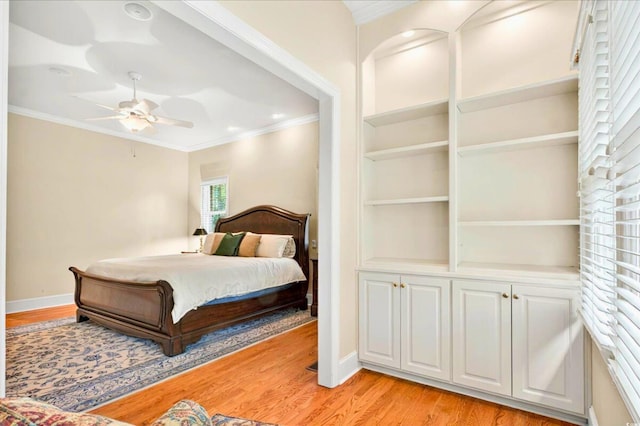 79 Windsor Cir SW, Ocean Isle Beach, NC 28469 - bedroom featuring ornamental molding, light wood-style floors, baseboards, and ceiling fan