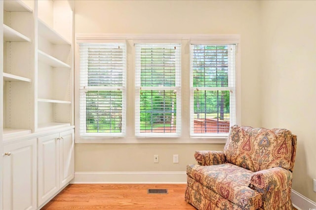 79 Windsor Cir SW, Ocean Isle Beach, NC 28469 - living area with light wood-style flooring, baseboards, and plenty of natural light