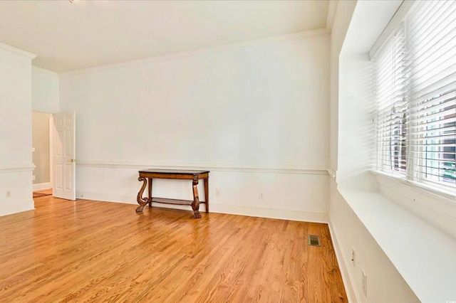 79 Windsor Cir SW, Ocean Isle Beach, NC 28469 - spare room with crown molding, light wood finished floors, and baseboards