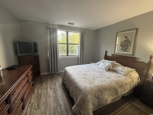 5001 Little River Rd Unit E-306, Myrtle Beach, SC 29577 - bedroom featuring wood finished floors and baseboards