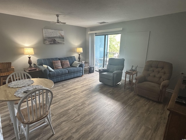 5001 Little River Rd Unit E-306, Myrtle Beach, SC 29577 - living area with wood finished floors and ceiling fan
