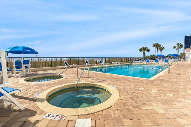 2511 S Ocean Blvd S Unit 1802B, Myrtle Beach, SC 29577 - community pool featuring a hot tub and a patio