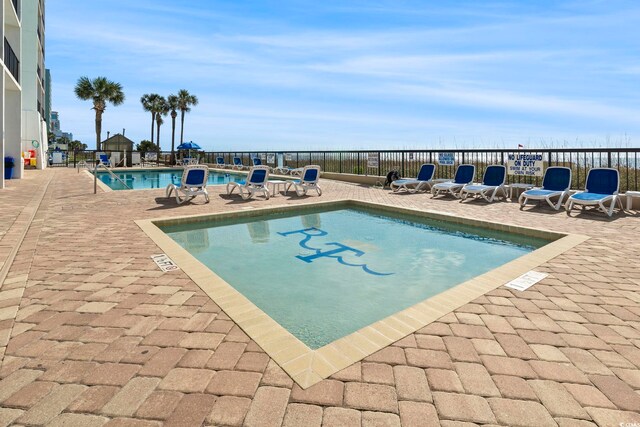 2511 S Ocean Blvd S Unit 1802B, Myrtle Beach, SC 29577 - community pool featuring a patio area