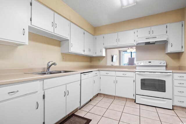 2511 S Ocean Blvd S Unit 1802B, Myrtle Beach, SC 29577 - kitchen featuring white appliances, under cabinet range hood, a sink, light countertops, and light tile patterned flooring