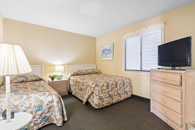 2511 S Ocean Blvd S Unit 1802B, Myrtle Beach, SC 29577 - bedroom featuring dark carpet