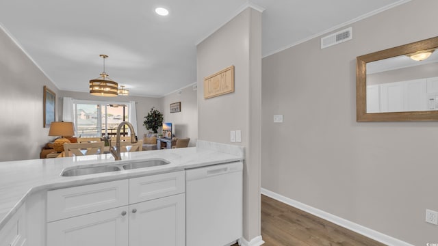 9501 Shore Dr Unit A-211, Myrtle Beach, SC 29572 - kitchen with dishwasher, a sink, wood finished floors, white cabinetry, and crown molding