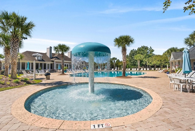community pool featuring a patio