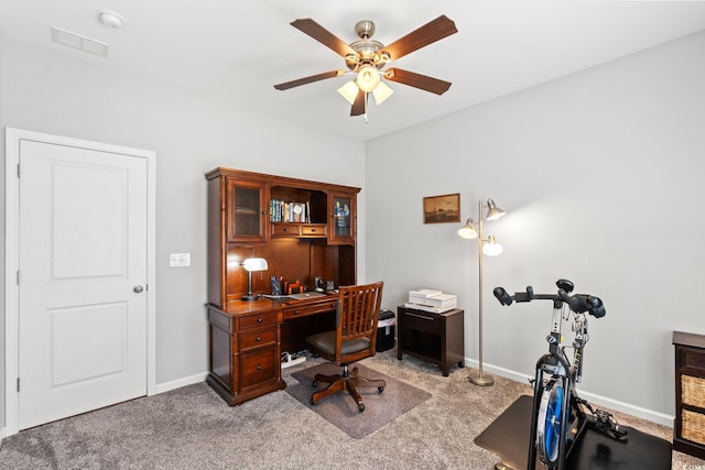 office space featuring ceiling fan, carpet, and baseboards