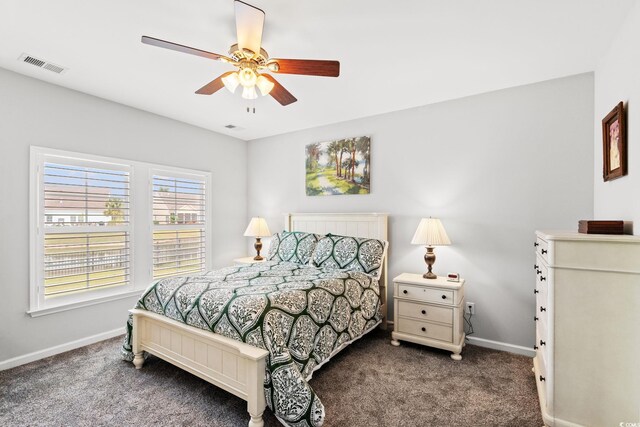 carpeted bedroom featuring baseboards and a ceiling fan