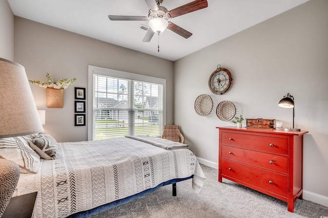 bedroom with baseboards, carpet floors, and ceiling fan