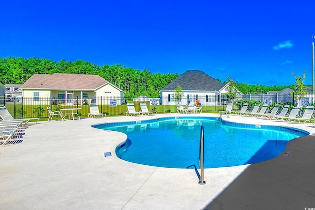 community pool featuring a patio area