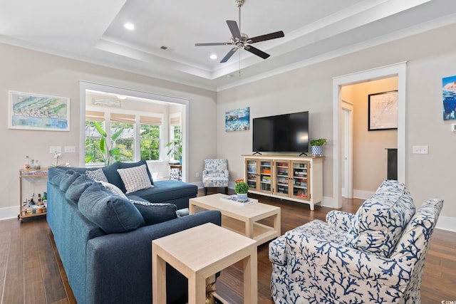 living area featuring a tray ceiling, baseboards, a ceiling fan, recessed lighting, and dark wood-type flooring