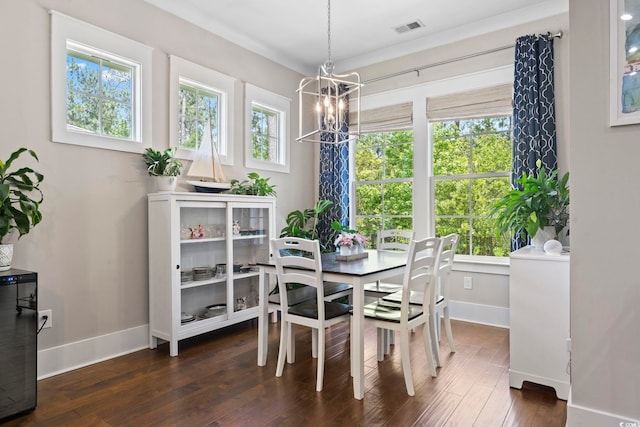 dining room with a chandelier, baseboards, and healthy amount of natural light