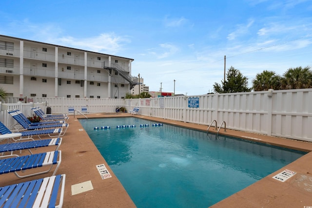 community pool featuring fence