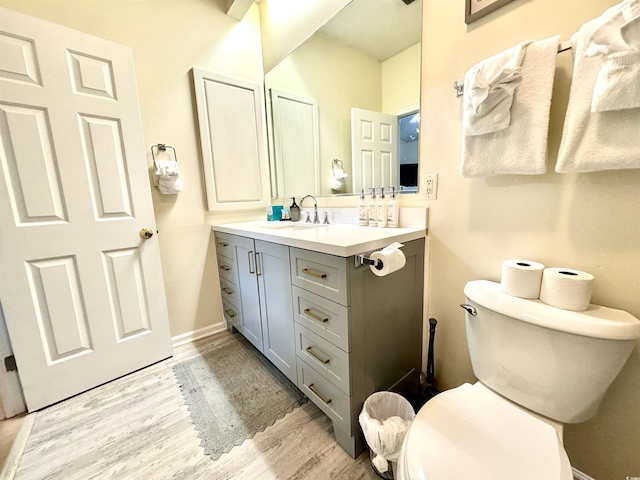 9780 Leyland Dr Unit 112, Myrtle Beach, SC 29572 - bathroom featuring toilet, wood finished floors, vanity, and baseboards