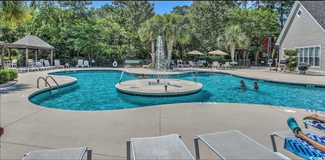 9780 Leyland Dr Unit 112, Myrtle Beach, SC 29572 - community pool with a patio area, a gazebo, view of wooded area, and fence