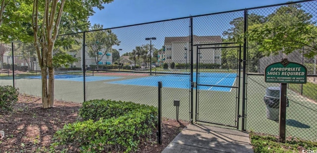 9780 Leyland Dr Unit 112, Myrtle Beach, SC 29572 - view of tennis court with a gate and fence