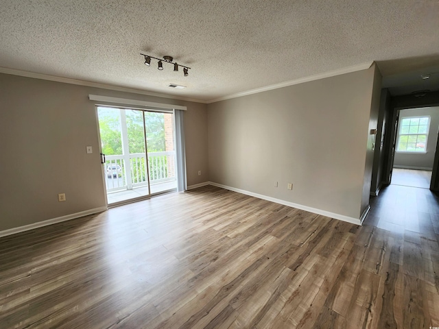 3786 Hitchcock Way Unit 321, Myrtle Beach, SC 29577 - spare room featuring wood finished floors, track lighting, a textured ceiling, crown molding, and baseboards