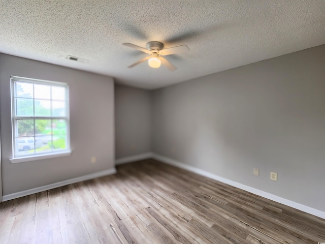 3786 Hitchcock Way Unit 321, Myrtle Beach, SC 29577 - unfurnished room with a ceiling fan, wood finished floors, baseboards, and a textured ceiling