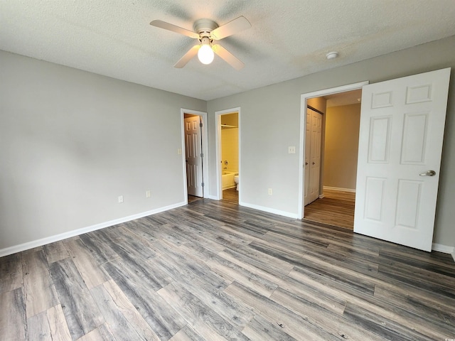 3786 Hitchcock Way Unit 321, Myrtle Beach, SC 29577 - unfurnished bedroom featuring wood finished floors, baseboards, a textured ceiling, ensuite bath, and ceiling fan