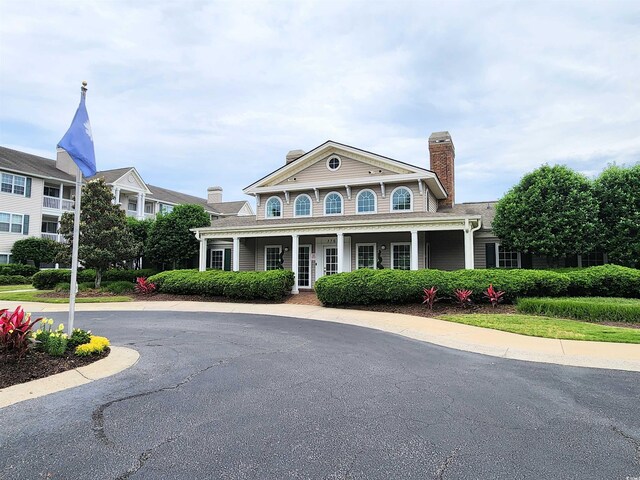 3786 Hitchcock Way Unit 321, Myrtle Beach, SC 29577 - view of front of property with a chimney and covered porch