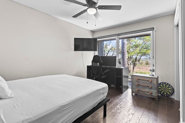 bedroom featuring hardwood / wood-style flooring, a ceiling fan, and vaulted ceiling