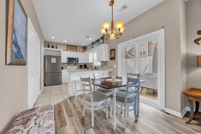 503 20th Ave N Unit 46B, North Myrtle Beach, SC 29582 - dining room featuring light wood finished floors, a chandelier, recessed lighting, and baseboards