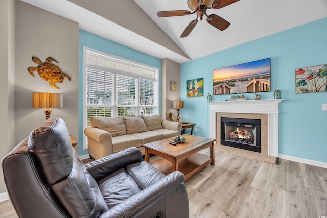 503 20th Ave N Unit 46B, North Myrtle Beach, SC 29582 - living area featuring lofted ceiling, ceiling fan, light wood finished floors, a tile fireplace, and baseboards