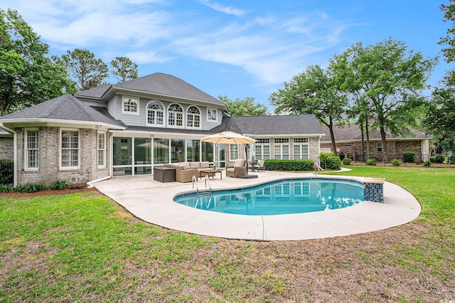 78 Oakmont Dr, Pawleys Island, SC 29585 - back of house featuring outdoor lounge area, a lawn, brick siding, and a patio area
