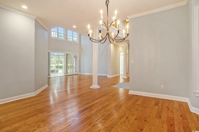 78 Oakmont Dr, Pawleys Island, SC 29585 - unfurnished dining area featuring a chandelier, baseboards, recessed lighting, crown molding, and light wood-style flooring